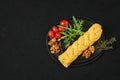 Smoked braided cheese on a plate, view from above