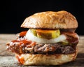 Smoked brisket sandwich with pickles, onions and bbq sauce Royalty Free Stock Photo