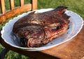 Smoked carp on a white plate.