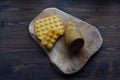 Smoked cheese , Traditional home smoked cheese, on the Wood background. cheese on a cutting board, whith spice and nuts.