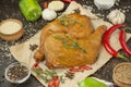 Smoked chicken legs on parchment with spices, closeup. Chicken dishes. Culinary background for recipes