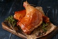 Smoked chicken legs on a wooden board, rustic style Royalty Free Stock Photo