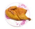 Smoked chicken on a plate on a white background closeup