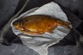 Smoked fish bream on paper Royalty Free Stock Photo
