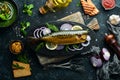 Smoked fish mackerel with onion and lemon on a black plate. Top view. Free space for your text. Royalty Free Stock Photo