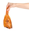 Smoked fish perch in hand Royalty Free Stock Photo