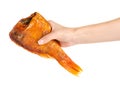 Smoked fish perch in hand Royalty Free Stock Photo