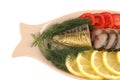 Smoked fish served with vegetables Royalty Free Stock Photo