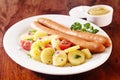 Smoked frankfurters served with potatoes Royalty Free Stock Photo