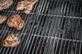 Smoked grill grate with fried steaks Royalty Free Stock Photo
