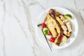 Smoked halibut steaks on a marble background Royalty Free Stock Photo