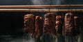 Smoked ham, bacon, pork in a smokehouse. Traditional method of smoking meat in smoke. banner, menu, recipe place for text