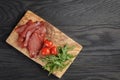 Smoked ham prsut with cherry tomatoes and arugula