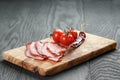 Smoked ham prsut with cherry tomatoes and chili