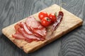 Smoked ham prsut with cherry tomatoes and chili