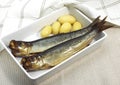 Smoked Herring or Bouffi Bloaster, clupea harengus, Smoked Fishes with Potatoes Royalty Free Stock Photo