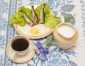 Smoked herring with fried egg Royalty Free Stock Photo