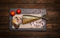 Smoked mackerel background. Smoked mackerel on slate board, top Royalty Free Stock Photo