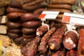 Smoked meat products at market or butcher shop Royalty Free Stock Photo