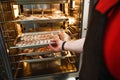 Smoked meat products in the oven smokehouse. Royalty Free Stock Photo