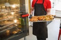 Smoked meat products in the oven smokehouse. Royalty Free Stock Photo