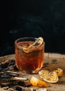 Smoked old fashioned cocktail on dark wooden background