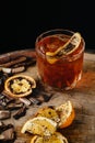 Smoked old fashioned cocktail on dark wooden background