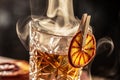 Smoked old fashioned rum cocktail with cubes of ice around on a dark background Royalty Free Stock Photo