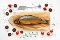 Smoked Omul fish with herbs and tomatoes
