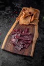 Smoked pork ears with salty dry rye bread. Royalty Free Stock Photo