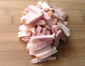 Smoked pork ham cut into strips on wooden background. Keto, carnivor, fat food diet concept