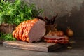 Smoked pork ham on a kitchen table Royalty Free Stock Photo