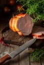 Smoked pork ham on a wooden table Royalty Free Stock Photo