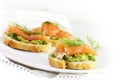 Smoked salmon and avocado cream or guacamole on baguette slices