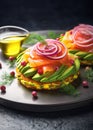 Smoked salmon with avocado and red onion on potato cakes