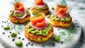 Smoked salmon with avocado and red onion on potato cakes