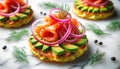 Smoked salmon with avocado and red onion on potato cakes