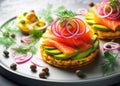 Smoked salmon with avocado and red onion on potato cakes