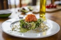 Smoked salmon avocado walnut salad on white plate with pesto Royalty Free Stock Photo