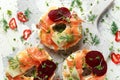 Smoked salmon bagel toasts with soft cheese, cucumber ribbons and beetroot and dill, cress salad Royalty Free Stock Photo