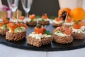 Smoked salmon canapes with cheese cream and capers on rye bread Royalty Free Stock Photo