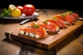 smoked salmon on cedar plank with sliced tomatoes