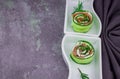 smoked salmon with cucumber and  soft cheese rolls on white plat Royalty Free Stock Photo