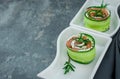 smoked salmon with cucumber and  soft cheese rolls on white plate Royalty Free Stock Photo