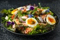 Smoked salmon and jammy soft-boiled free range egg and capers salad with edible borage and pansy flowers