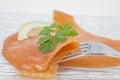 Smoked salmon with parsley solated on white background