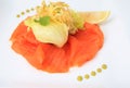 Smoked salmon salad on white plate background, lemon and vegetable on top of it Royalty Free Stock Photo