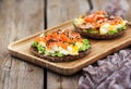 Smoked salmon, scrambled eggs and avocado rye crisp toast