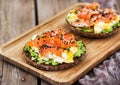 Smoked salmon, scrambled eggs and avocado rye crisp toast