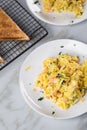 Smoked salmon with scrambled eggs, whole grain bread toast and dill on marble background Royalty Free Stock Photo